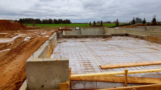 Concrete floor construction for housing infrastructure