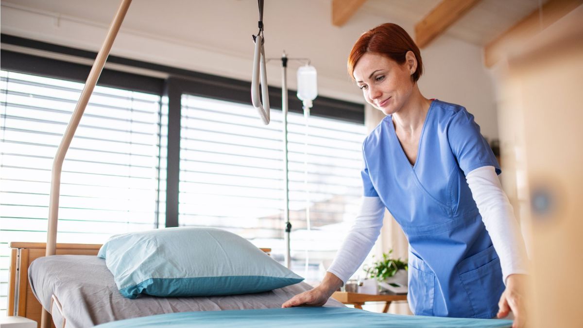 Healthcare staff preparing a patient room